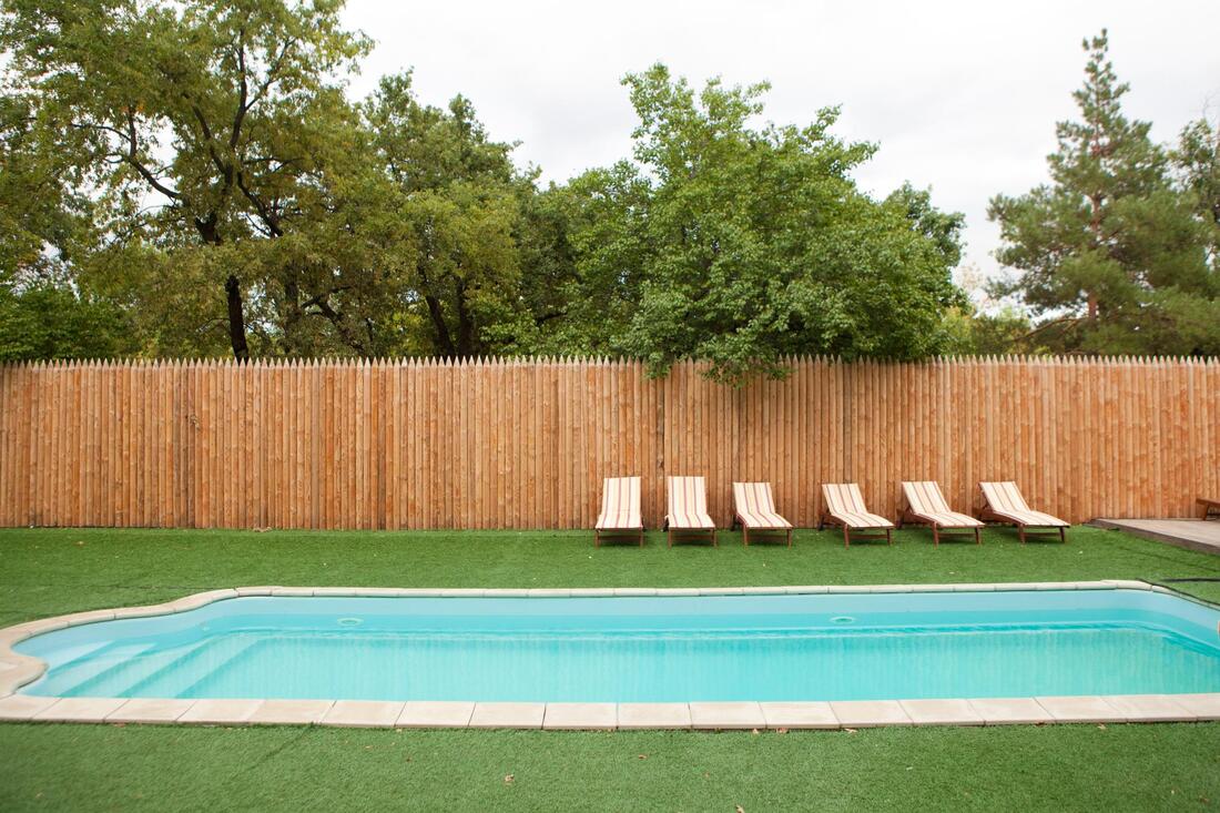 a residential fence on a pool